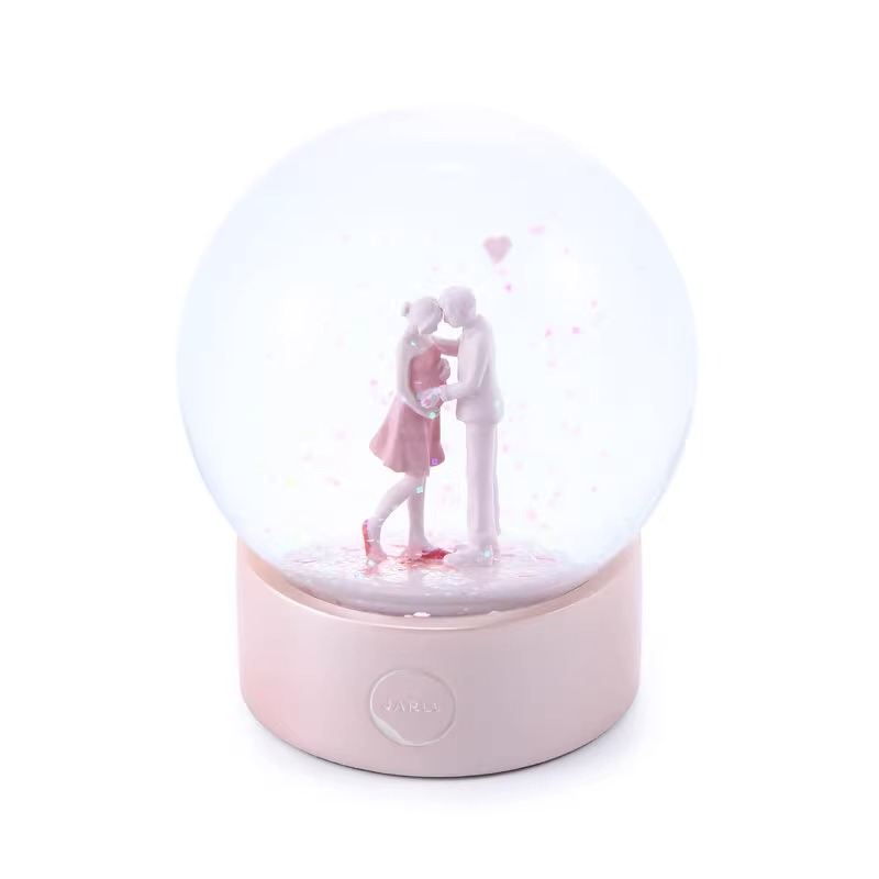 Snow Globe Couple Kissing Pink